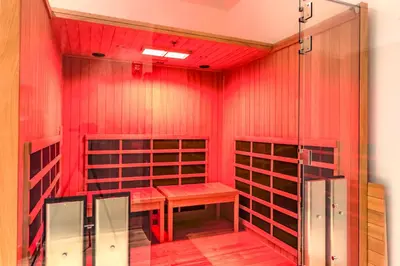 a wine cellar with a bench and red walls at Skyline Sanctuary in Cleveland