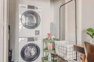 a laundry room with a washer and dryer at Skyline Sanctuary in Cleveland
