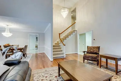 a living room with a couch and a table at 7 Mi to Dtwn Toledo Spacious Family Home! in Perrysburg