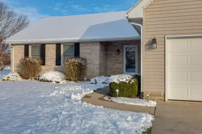 a house with snow in front of it at 1 mile to Downtown! Boat, Hike and Fish in Liberty