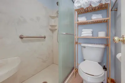 a bathroom with a toilet and a shower at 1 mile to Downtown! Boat, Hike and Fish in Liberty