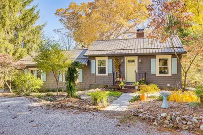 a small house with a gravel driveway at Trails, Wine and Events! Cuyahoga Falls Retreat in Cuyahoga Falls