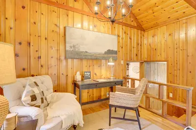 a living room with a desk and a chair at Trails, Wine and Events! Cuyahoga Falls Retreat in Cuyahoga Falls