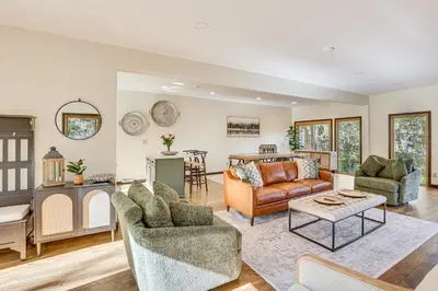 a living room with a couch and a table at Trails, Wine and Events! Cuyahoga Falls Retreat in Cuyahoga Falls