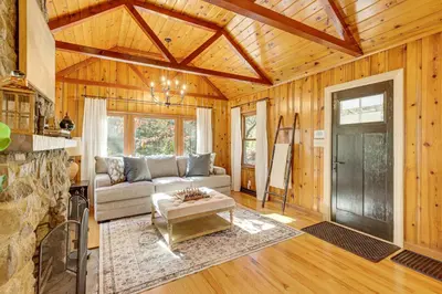 a living room with a couch and a table at Trails, Wine and Events! Cuyahoga Falls Retreat in Cuyahoga Falls