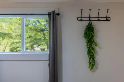 a green wreath hanging on a door with a window at Lakefront Vibes Lake Access•Hot Tub•Firepit•Pets in Rockbridge