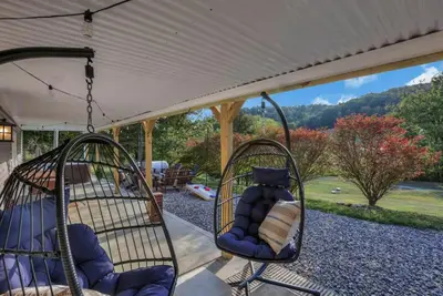 two swings in a porch with a view at Edens Hillside Haven in Laurelville