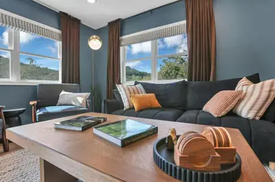 a living room with a couch and a table at Edens Hillside Haven in Laurelville