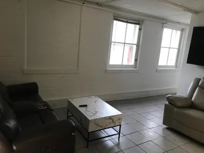 a living room with a couch and a coffee table at Castle Apartments in Marion