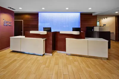 an office with two reception desks in a lobby at Fairfield Inn & Suites by Marriott Athens in Athens