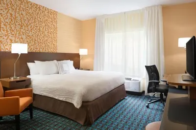 a hotel room with a bed and a desk at Fairfield Inn & Suites by Marriott Athens in Athens