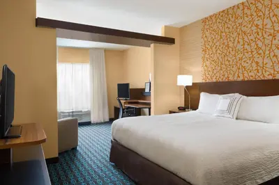 a hotel room with a bed and a desk at Fairfield Inn & Suites by Marriott Athens in Athens