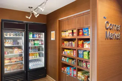 a grocery store with two refrigerators and food at Fairfield Inn & Suites by Marriott Athens in Athens