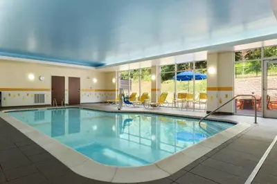a large swimming pool in a hotel room at Fairfield Inn & Suites by Marriott Athens in Athens