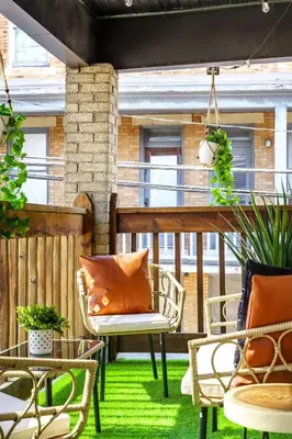 an outdoor patio with chairs and tables on the grass at Bamboo Bungalow by Jungle House Near Convention Center OSU & Nationwide Arena Walk to High Street Downtown & Short North 5 800 Reviews Private Parking in Columbus