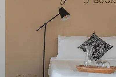 a bedroom with a bed with a lamp on it at Jungle Book by Jungle House Walkable to High Street Downtown & Short North Near Nationwide Arena OSU & Convention Center Free Parking 5 800 Reviews in Columbus