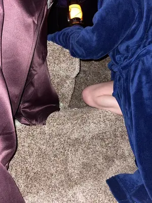 a person sitting on the floor with a light at GENIE ROMANCE SUITE with King Size Flying Carpet Bed, Jet Tub, Karaoke, Sultan's Foot Massage Room in Mount Vernon