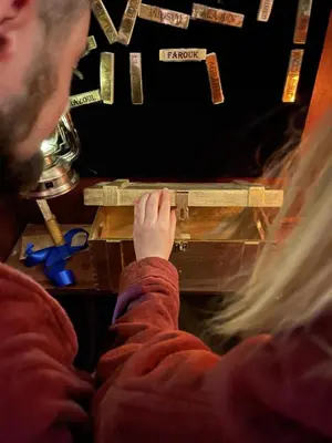 a person is working on a piece of wood at GENIE ROMANCE SUITE with King Size Flying Carpet Bed, Jet Tub, Karaoke, Sultan's Foot Massage Room in Mount Vernon