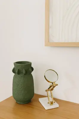 a mirror sitting on a table next to a vase at “Ivory Inn” - Cozy Modern Stay w/ Hot Tub - LEX in Lexington