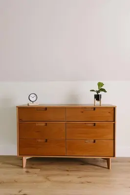 a wooden dresser with a plant on top of it at “Ivory Inn” - Cozy Modern Stay w/ Hot Tub - LEX in Lexington