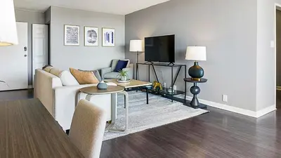 a living room with a couch and a tv at Landing Stunning Studio Game Room Pool in Fort Wayne