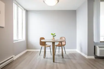a dining room with a table and two chairs at Landing Stunning Studio Game Room Pool in Fort Wayne