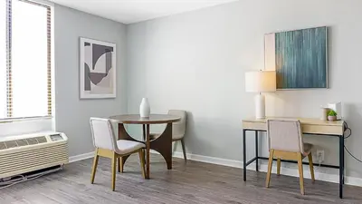 a dining room with a table and chairs at Landing Stunning Studio Game Room Pool in Fort Wayne