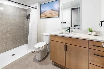 a bathroom with a toilet and a shower and a sink at Landing Amazing 2BD Gym Courtyard in Cleveland