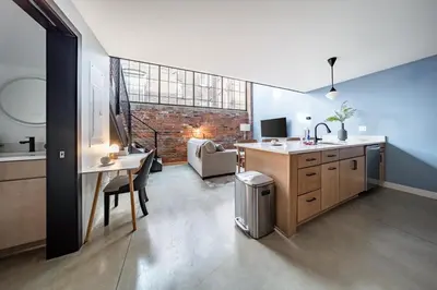 an office with a desk and a table with a chair at Landing Amazing 2BD Gym Courtyard in Cleveland