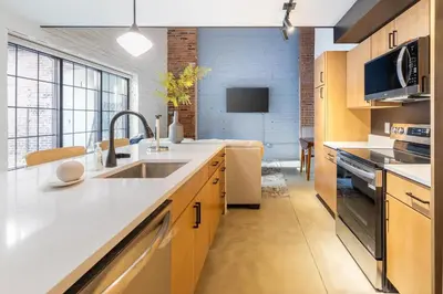 a kitchen with a sink and a counter top at Landing Amazing 2BD Gym Courtyard in Cleveland