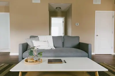a living room with a couch and a table at 