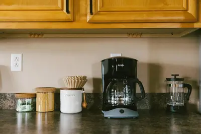a kitchen counter with a blender on a counter top at 