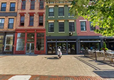 a scooter parked in front of a group of buildings at OTR - Court Street Entertainment District Cincinnati in Cincinnati