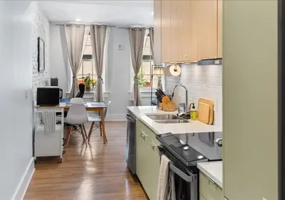 a kitchen with a sink and a counter top at OTR - Court Street Entertainment District Cincinnati in Cincinnati