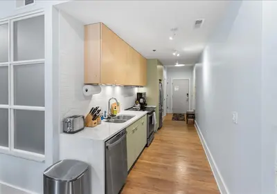 a kitchen with a sink and a counter at OTR - Court Street Entertainment District Cincinnati in Cincinnati