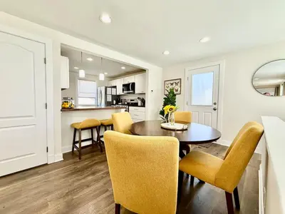 a kitchen and dining room with a table and chairs at Cute and Cozy House in Quiet Blue Ash Neighborhood in Blue Ash