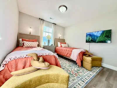 a bedroom with two beds and a window at Cozy Equestrian Themed Getaway in Wilmington in Wilmington