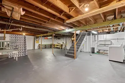 a garage with a staircase in the middle of a room at Akron in Akron