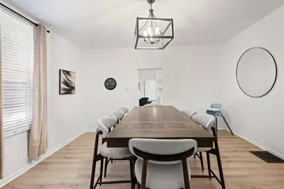 a dining room with a wooden table and chairs at Rivers Edge Retreat For 10ppl in Dayton