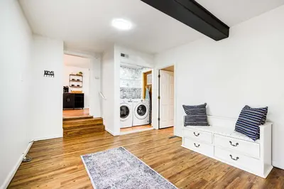 a laundry room with a washer and dryer at Serenity on Sanford in Portsmouth
