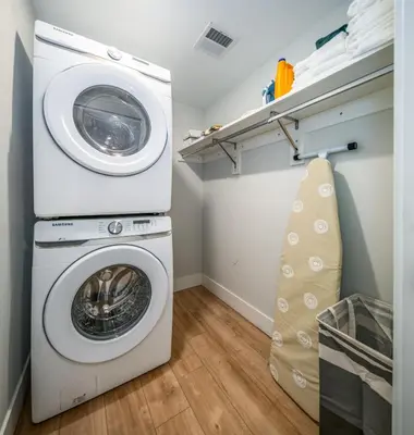 a laundry room with a washer and dryer at OTR 1BR by TQL, Sleeps 4ppl, Lux King Bed, Wifi, 4th Fl in Cincinnati