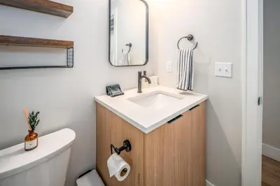 a bathroom with a sink and a toilet at OTR 1BR by TQL, Sleeps 4ppl, Lux King Bed, Wifi, 4th Fl in Cincinnati