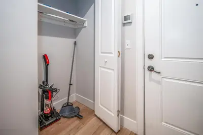 a room with a room with a broom and a door at OTR 1BR by TQL, Sleeps 4ppl, Lux King Bed, Wifi, 4th Fl in Cincinnati