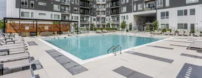 an image of a swimming pool at a apartment complex at The 513 Flat 2! 1BR, 1Bath Apt with Pool and Riverfront View! Free Gated Parking! Only Steps from The banks & Stadiums! in Cincinnati