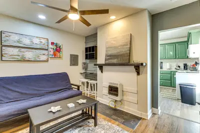 a living room with a bed and a kitchen at Close to Camden Clark Central Parkersburg Condo in Parkersburg