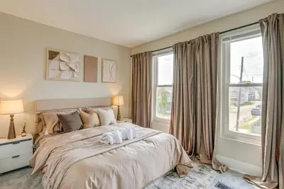 a bedroom with a bed with two towels on it at Quiet & Spacious Home Near Downtown in Columbus