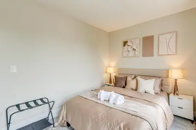 a bedroom with a bed with two towels on it at Quiet & Spacious Home Near Downtown in Columbus