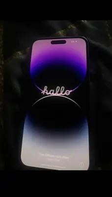 a purple and black cell phone sitting on a table at 133 S Highland St Apt A in Winchester