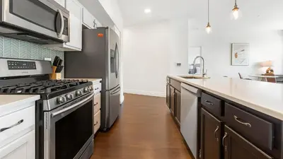 a kitchen with a stove and a sink at Landing Spectacular 2BD Gym in Cleveland