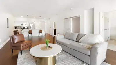 a living room with a couch and a table at Landing Spectacular 2BD Gym in Cleveland